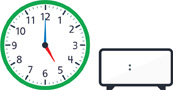 Hay un reloj con la manecilla de la hora apuntando al “5” y el minutero apuntando al “12”. Hay un reloj digital en blanco.
